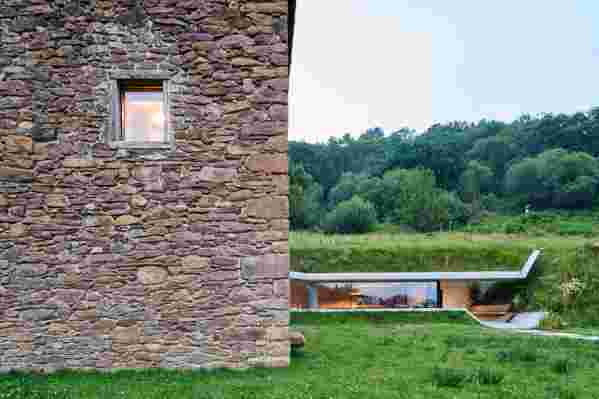 An Ultra-Modern Underground Corridor Was Built Into a Charming Spanish Home